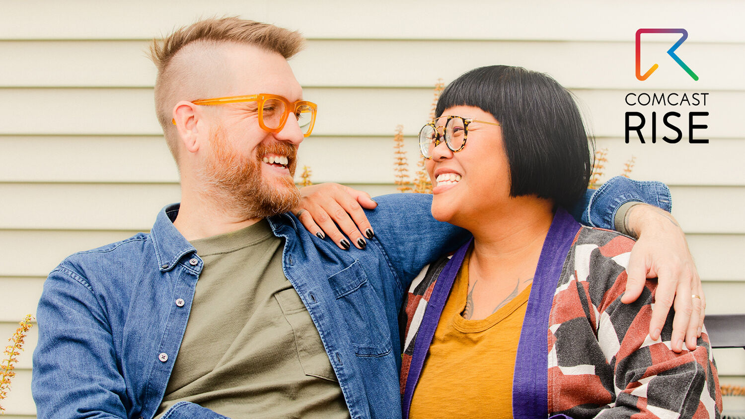 A man and a woman smiling.