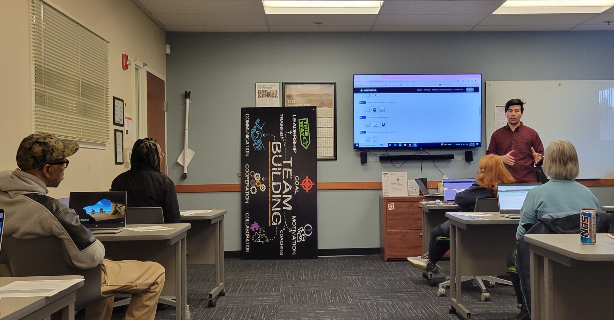A Workforce Development employee leads a class .